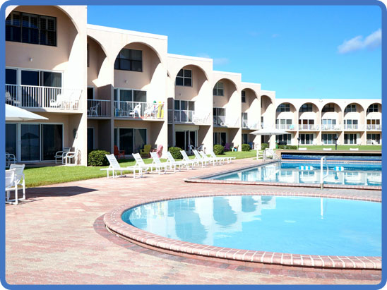 Balconied units facing the pool deck at Ocean Club North