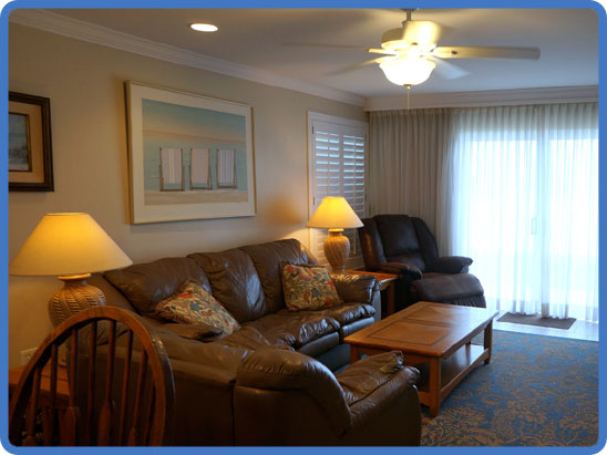 A furnished living room in an Ocean Club North condominium